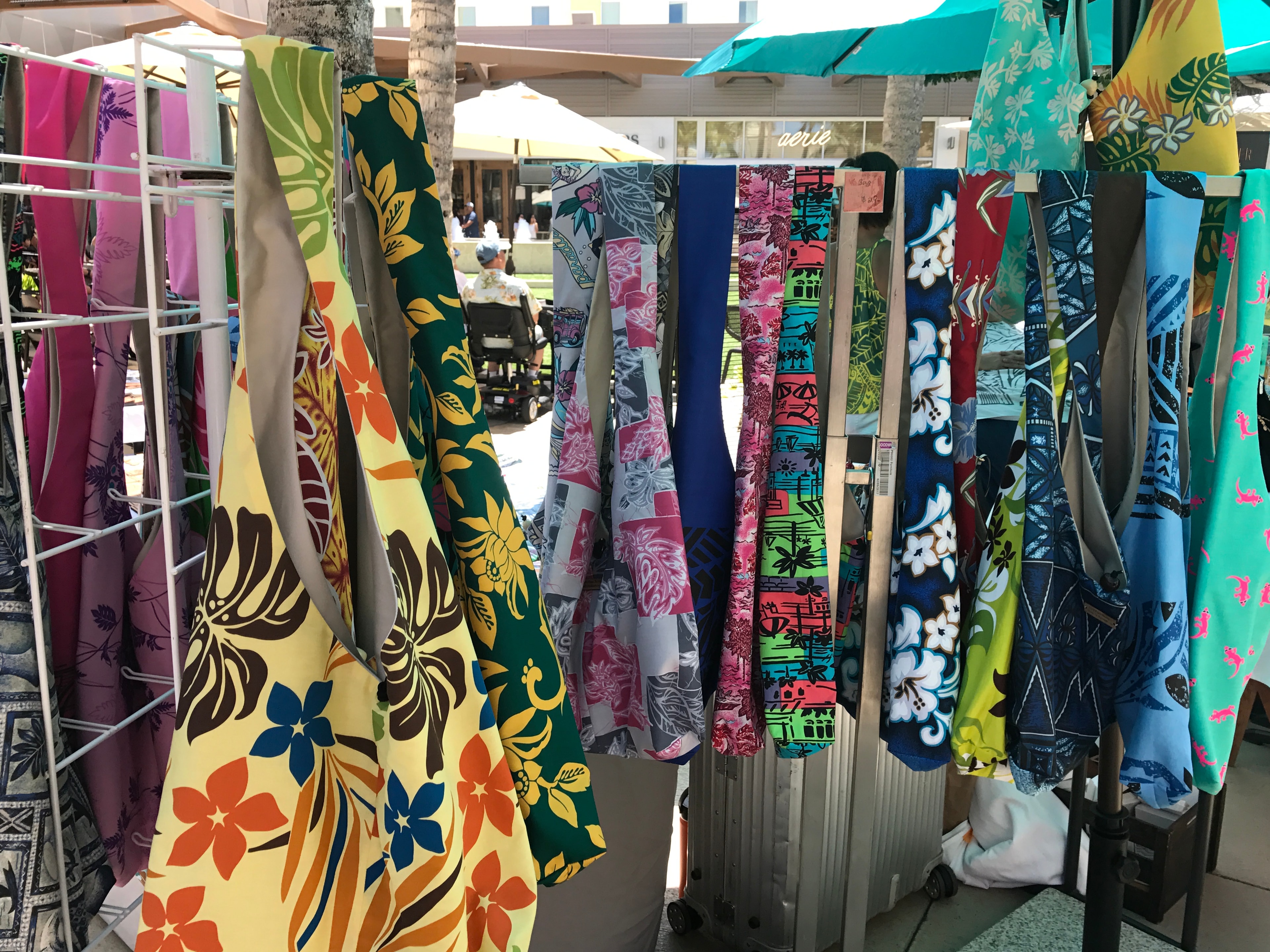Colorful patterned fabrics displayed at outdoor market