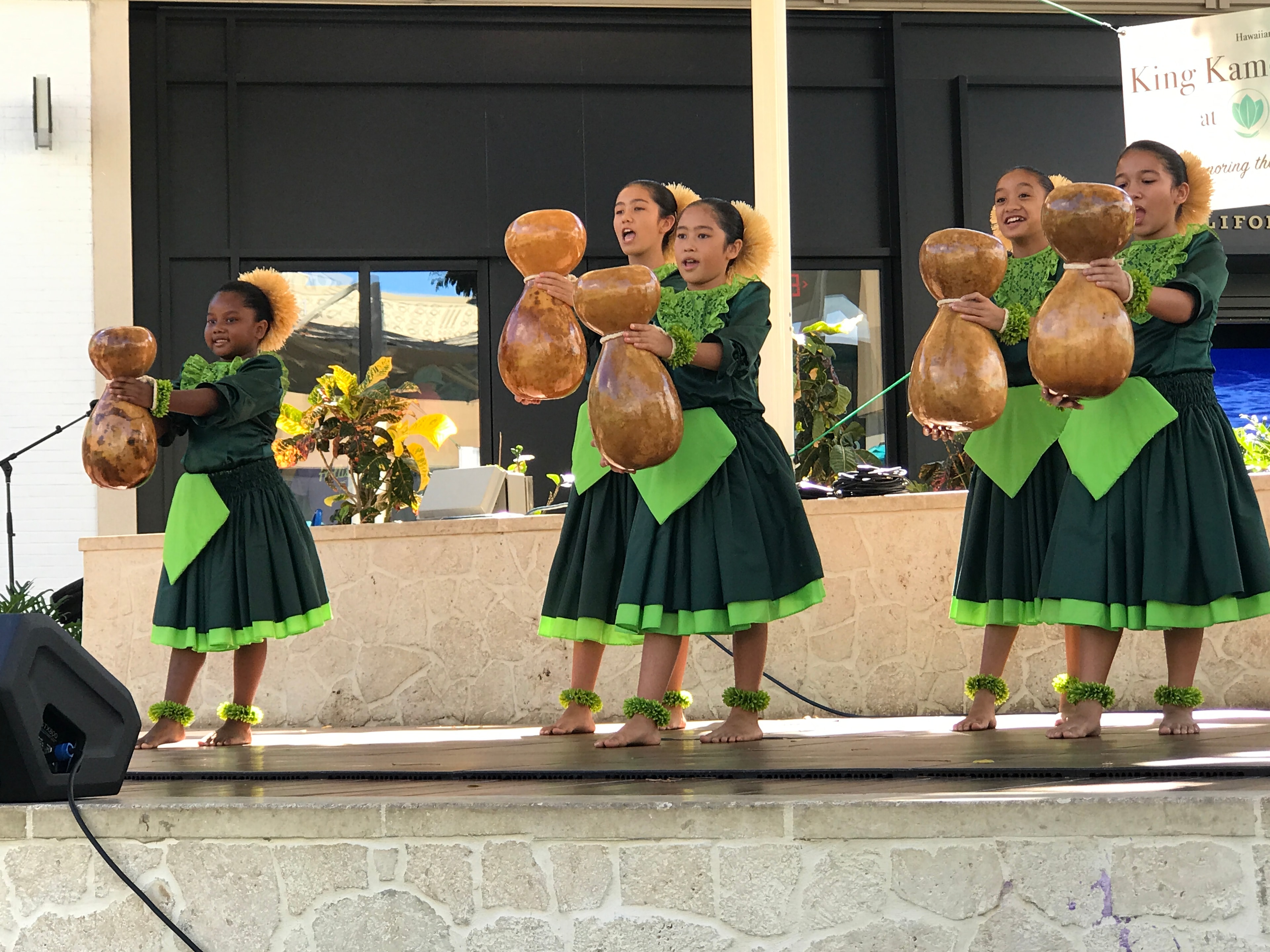 Children performing Hawaiian dance with gourds