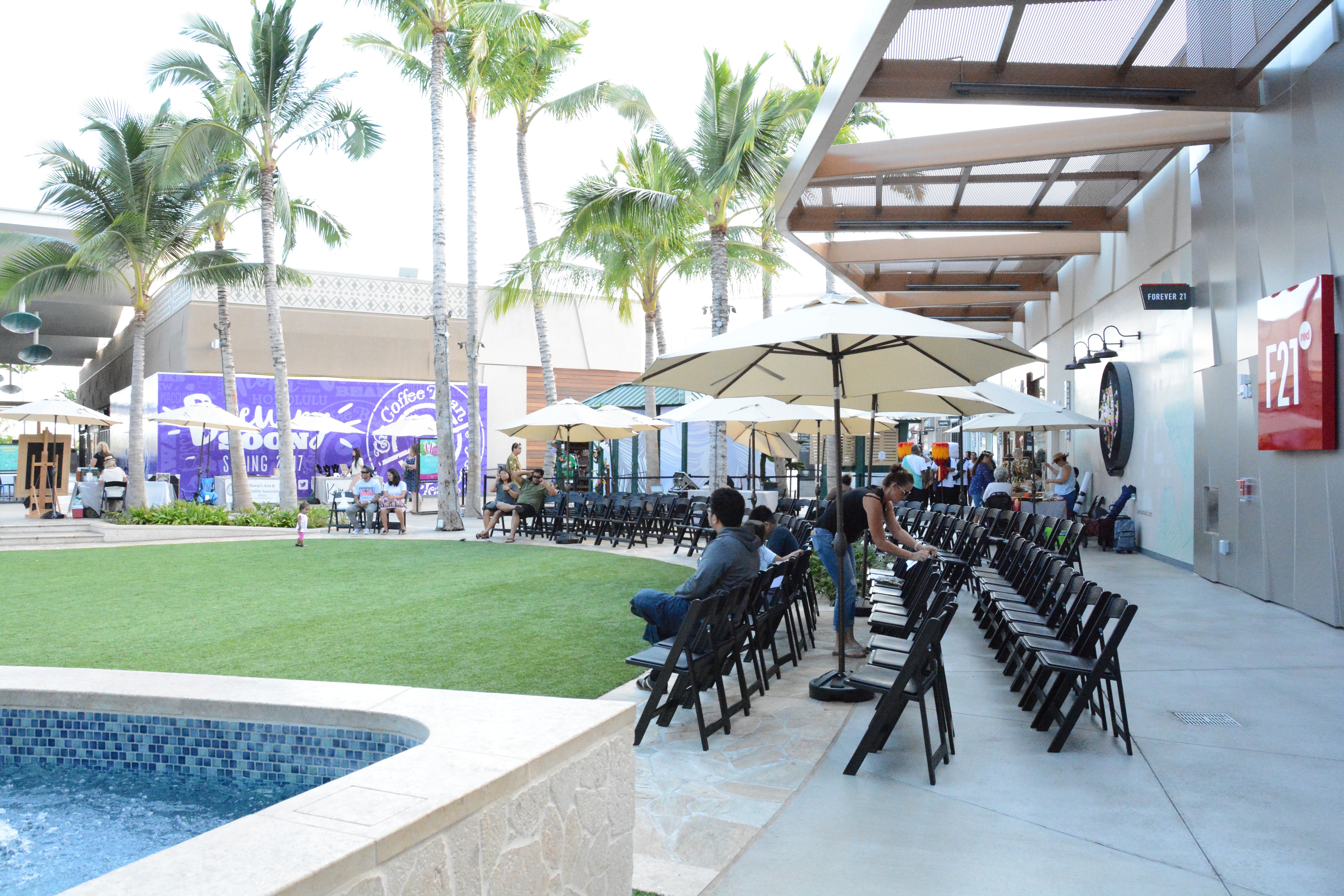 Modern outdoor mall courtyard with umbrellas
