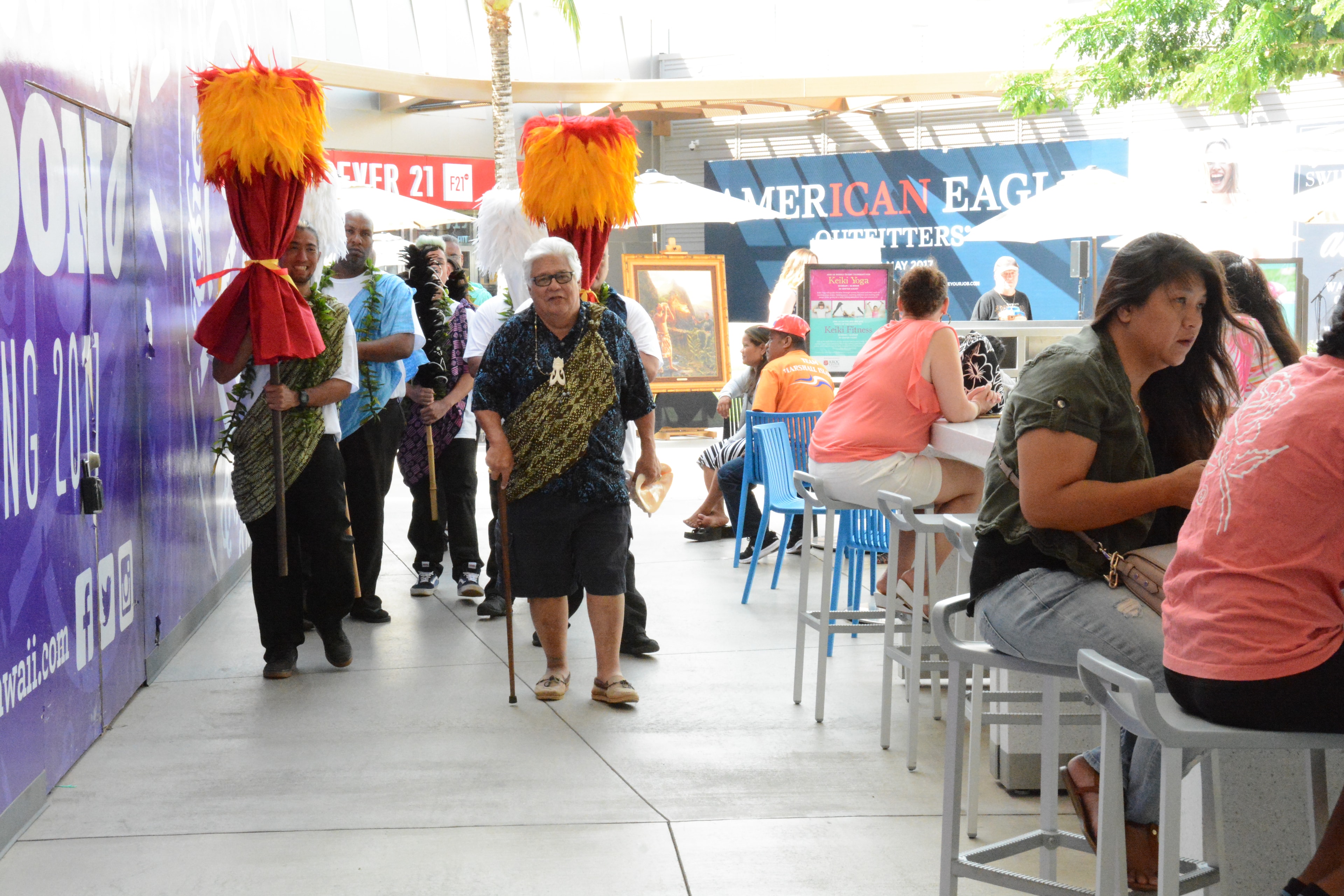 People at outdoor festival with mascots