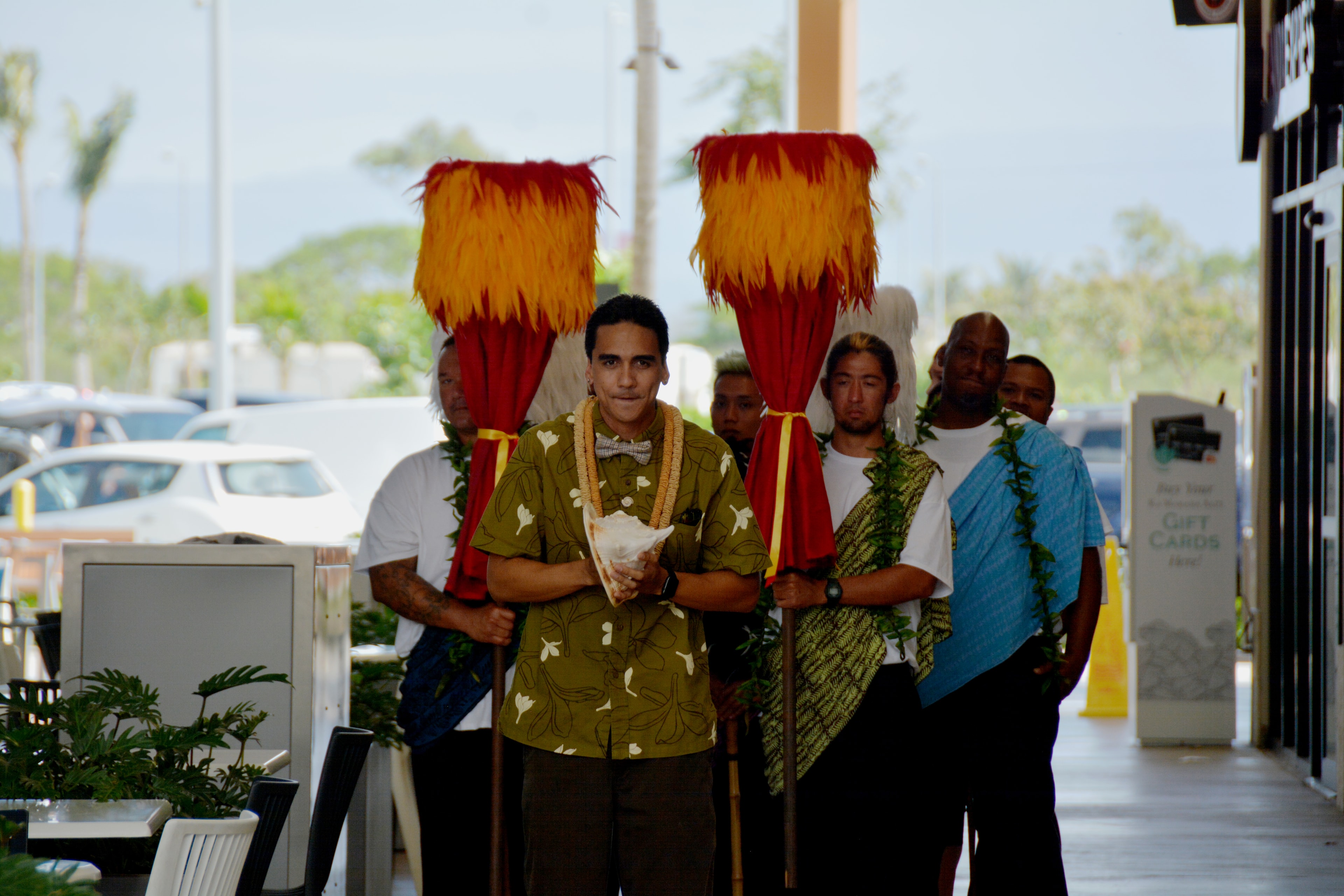 Group posing with traditional Hawaiian decorations