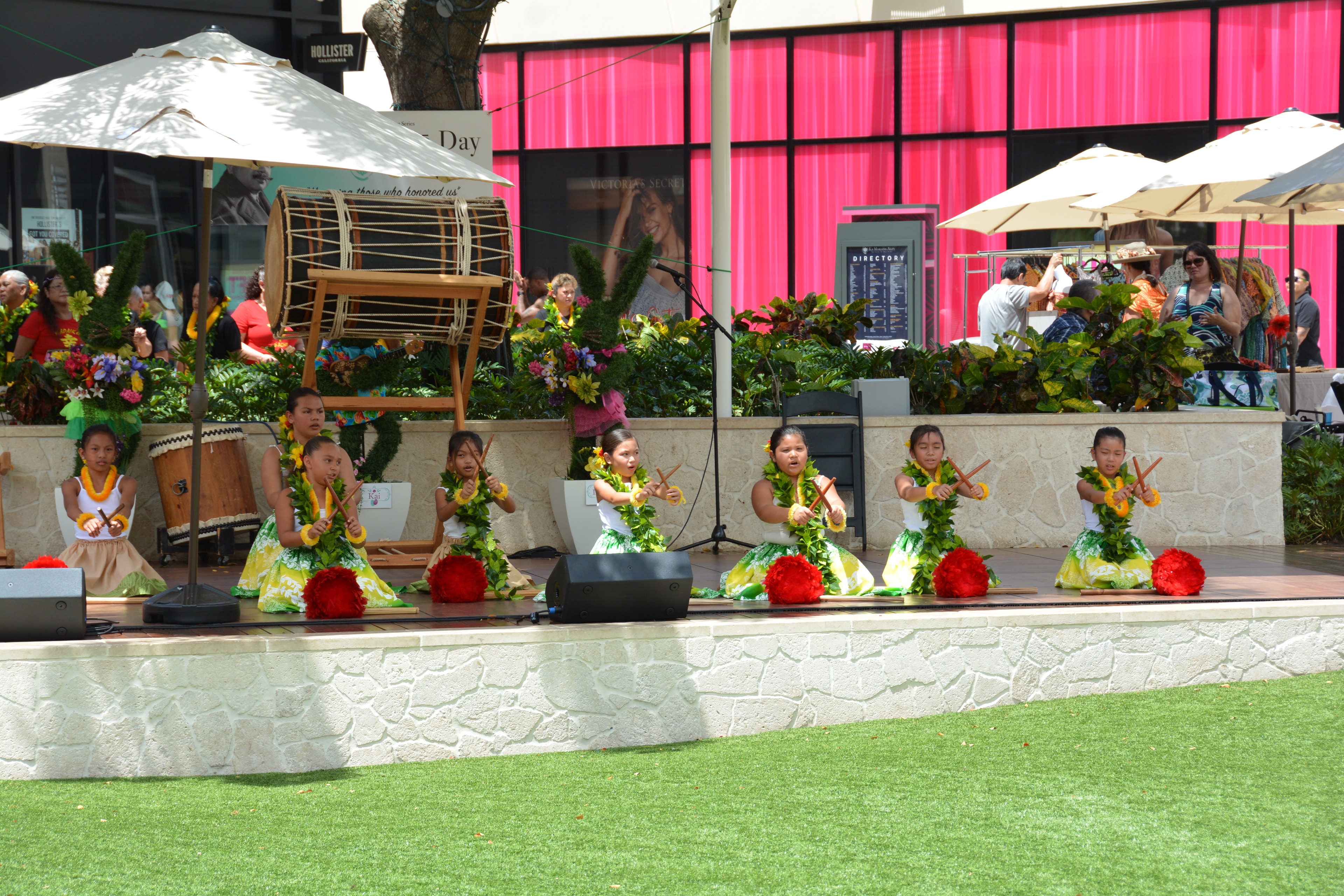Children performing Hawaiian hula dance outdoor stage
