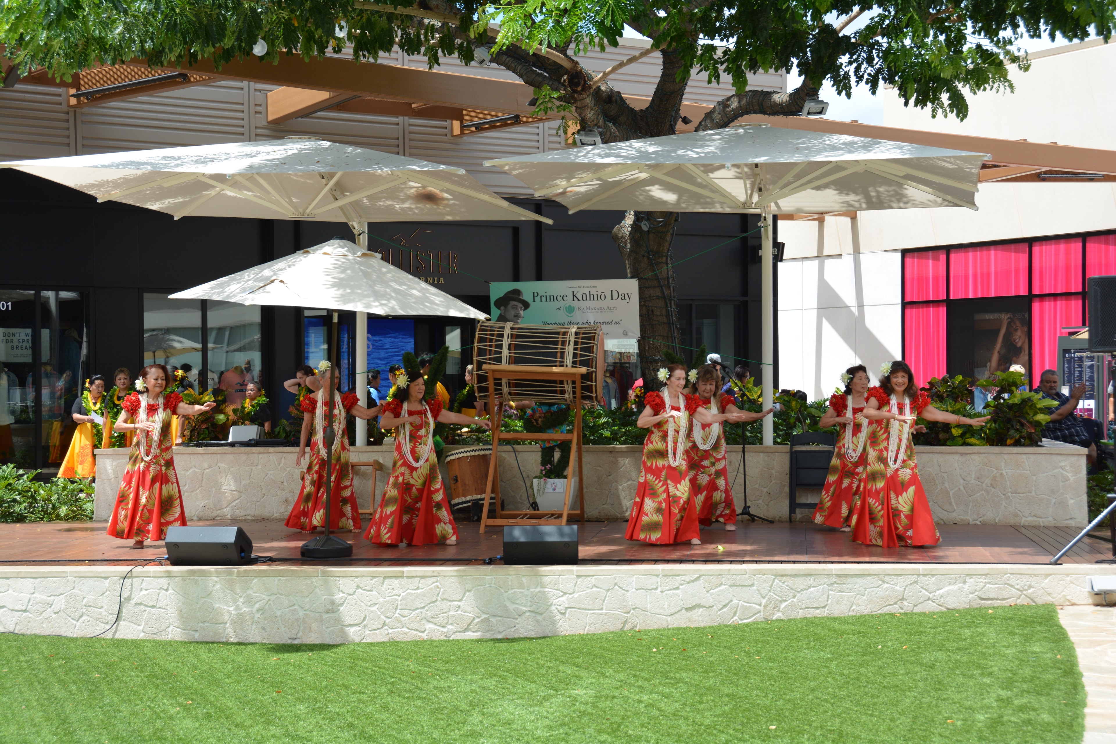 Hawaiian dancers performing outdoor stage event