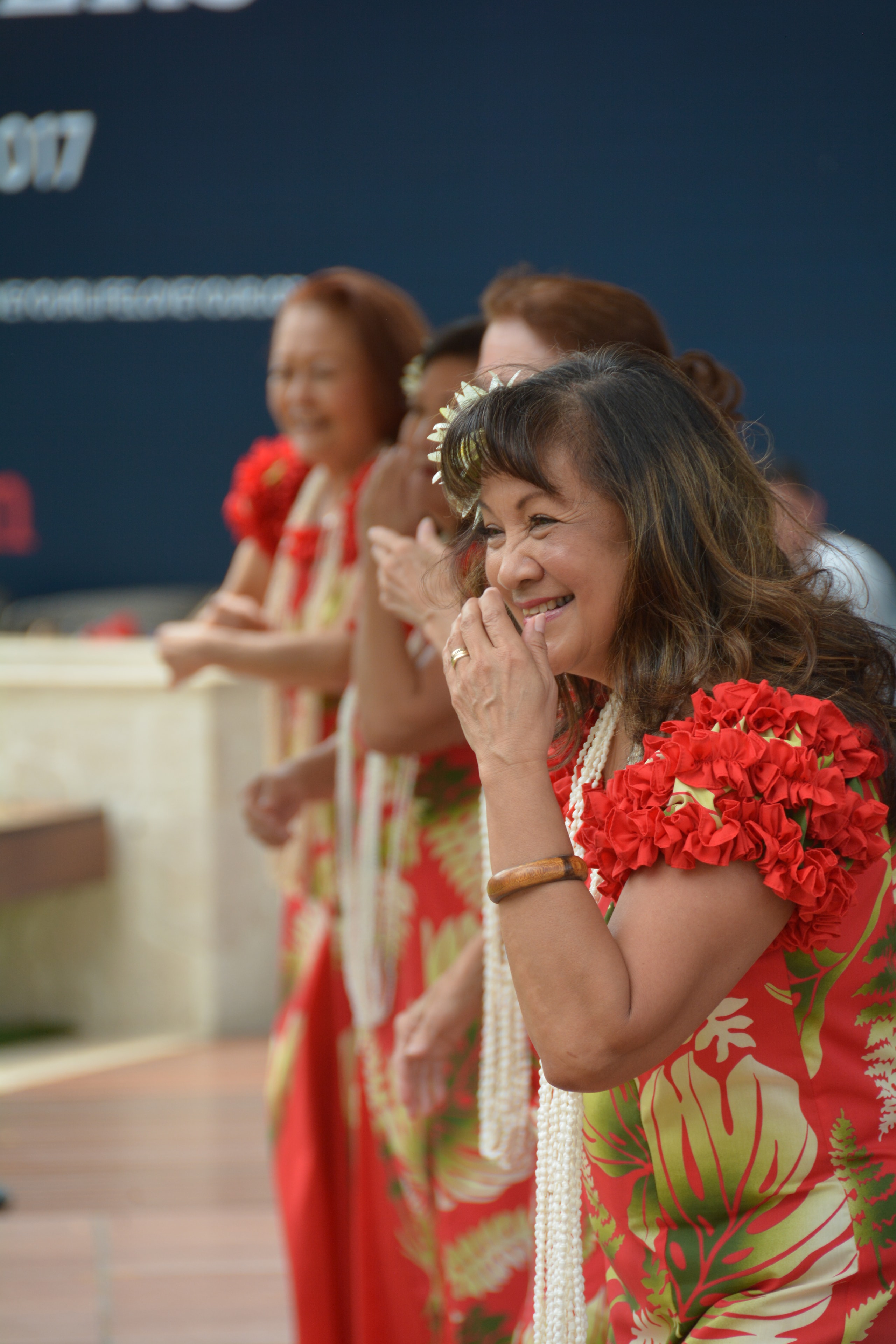 Woman in red traditional dress smiling