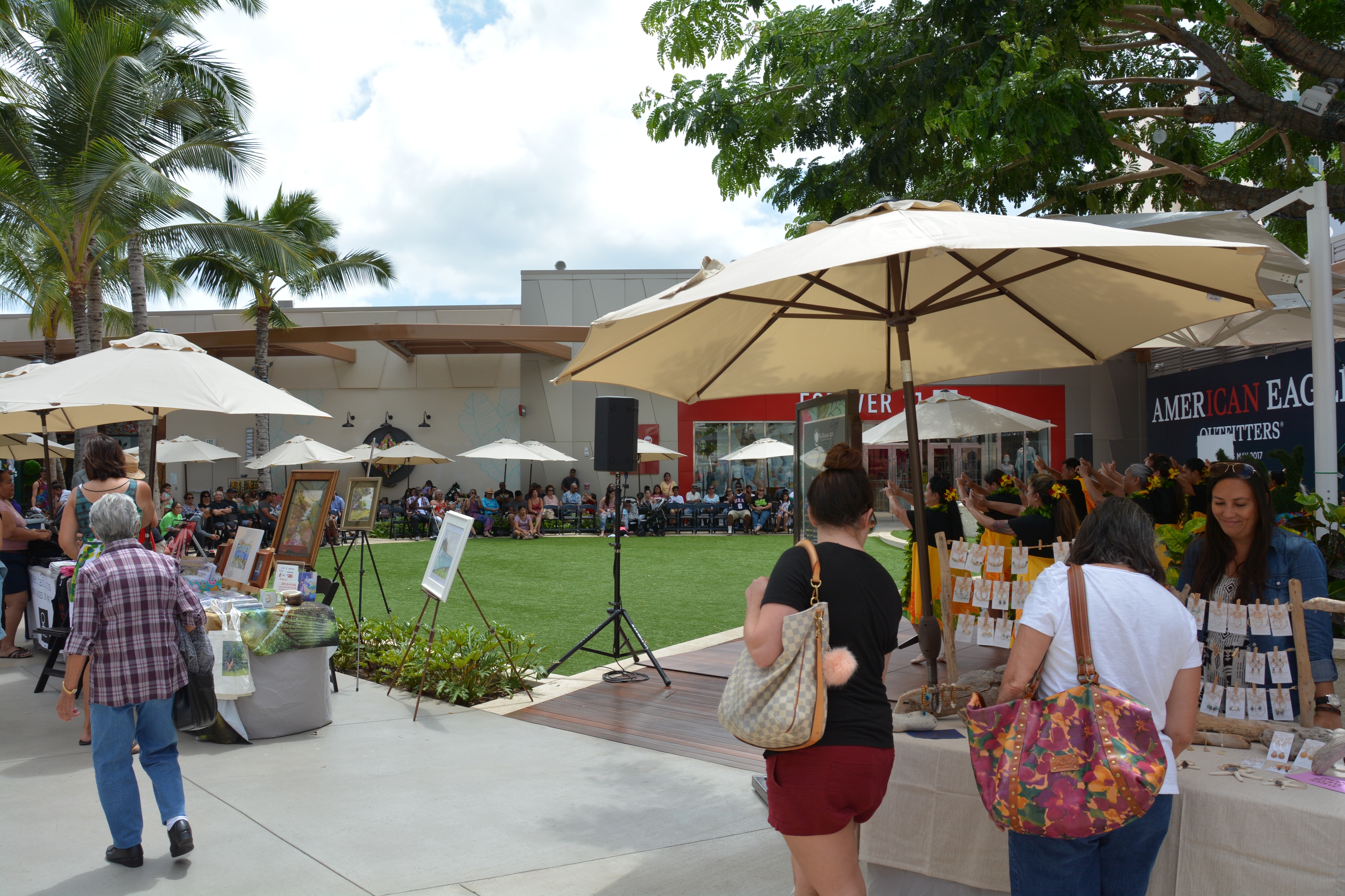Outdoor art festival courtyard with umbrellas