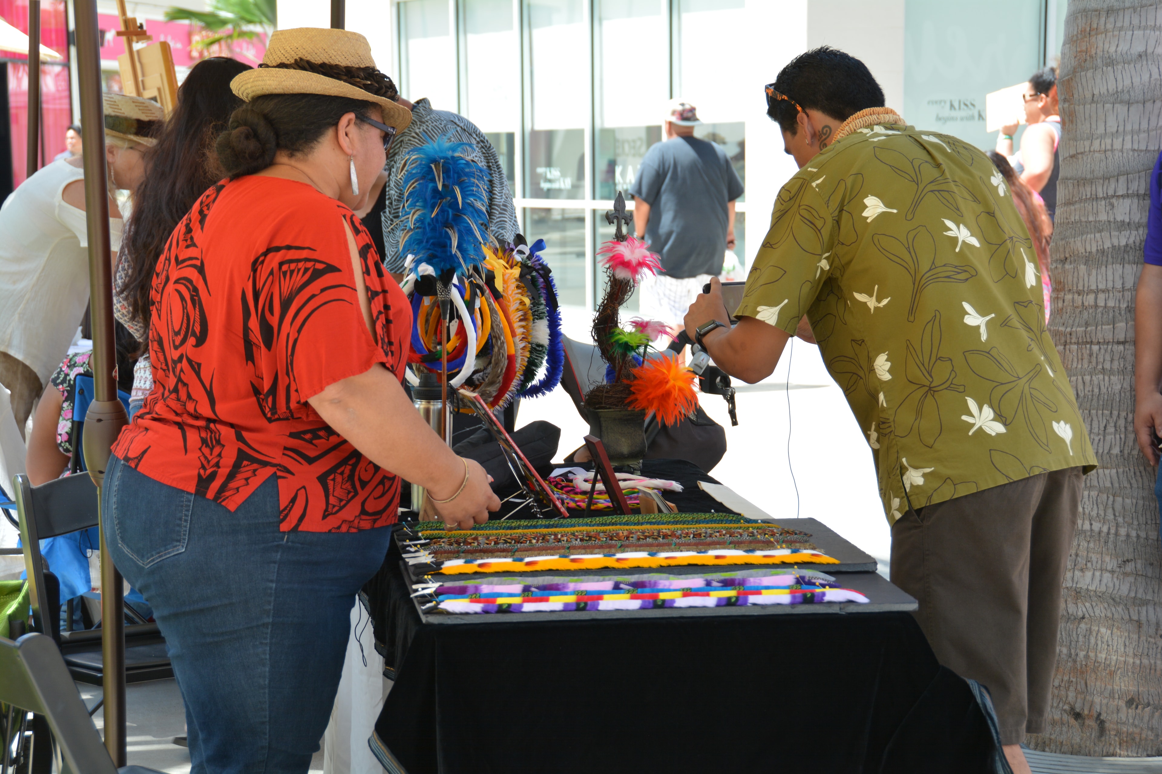 Vendor selling colorful handmade bracelets at market