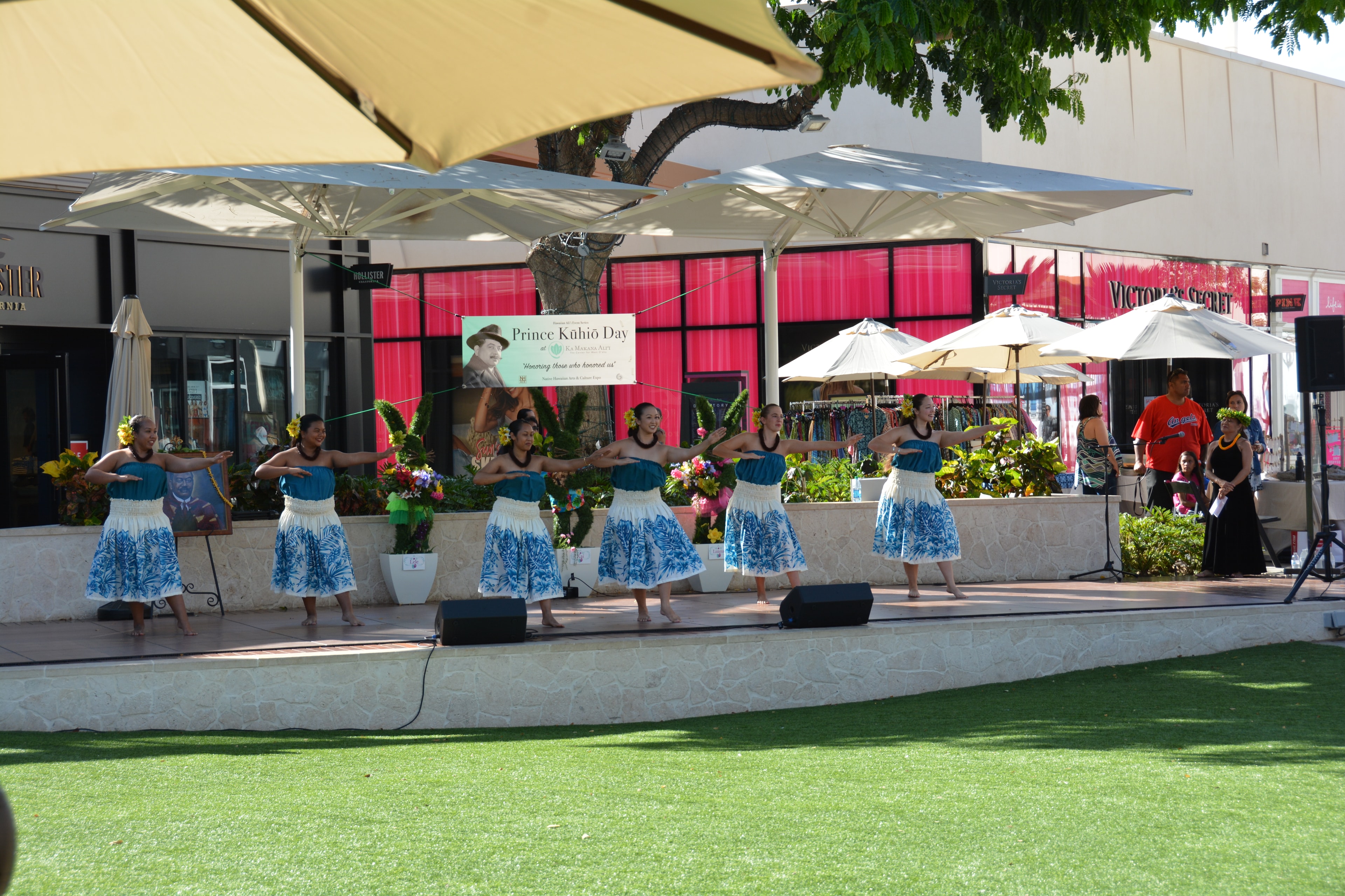 Hawaiian hula dancers performing outdoor stage event