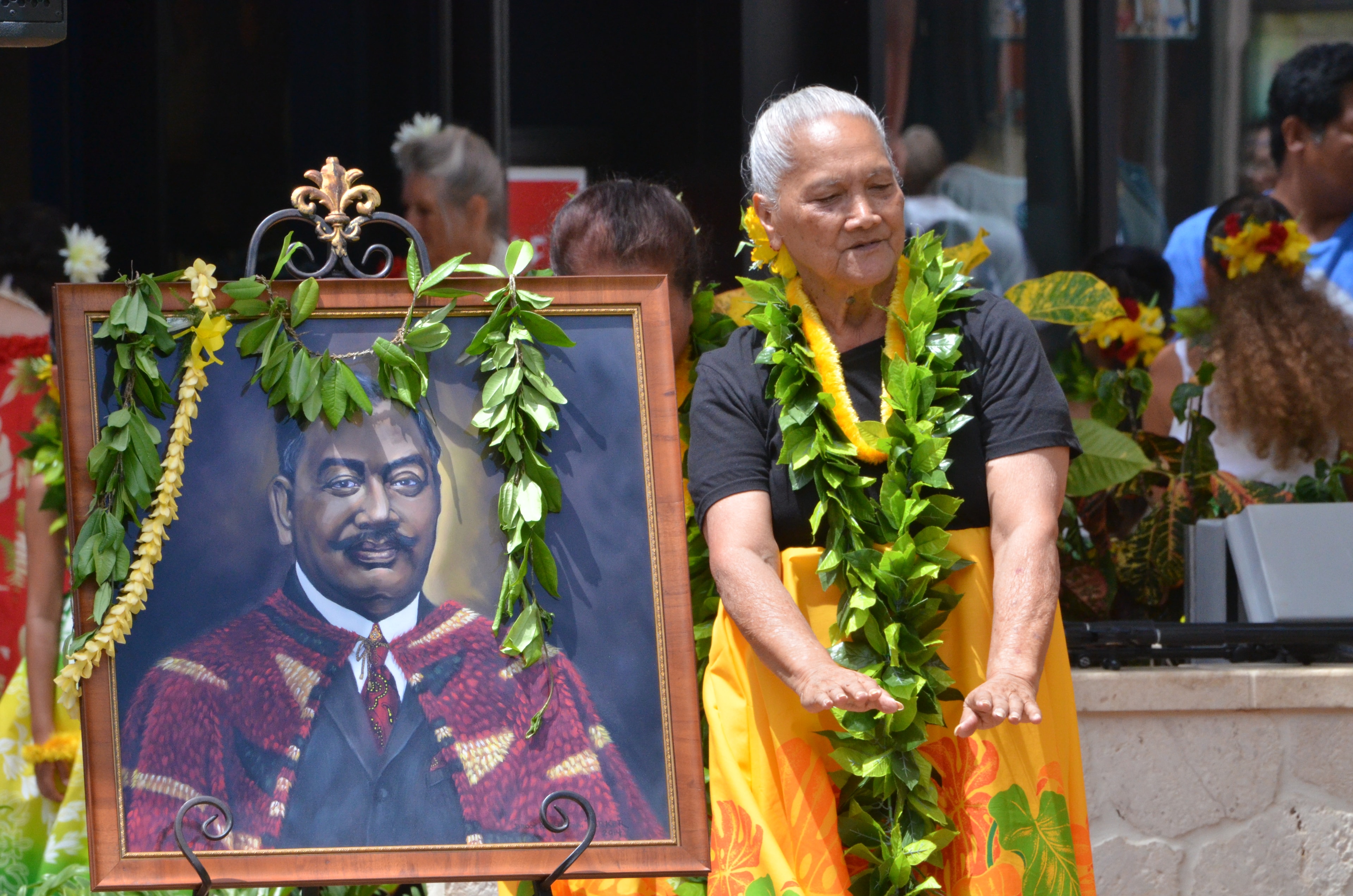Elder man lei garland portrait ceremony