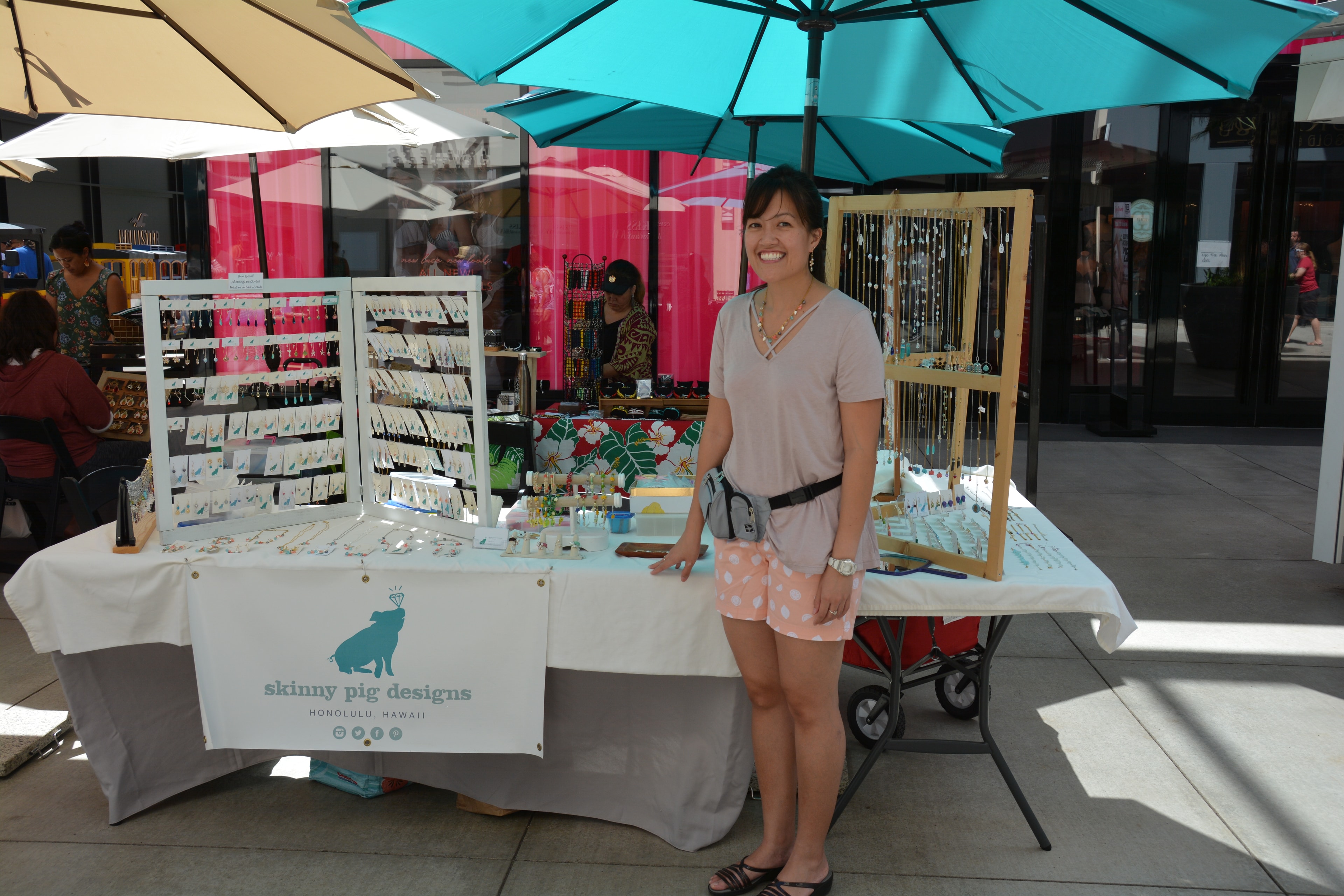 Skinny Pig Designs jewelry vendor booth at Prince Kūhiō Day market