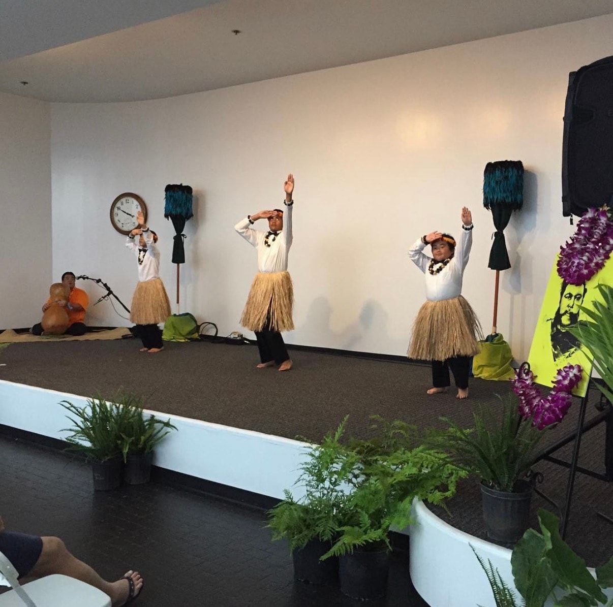 Children performing Hawaiian hula dance on stage