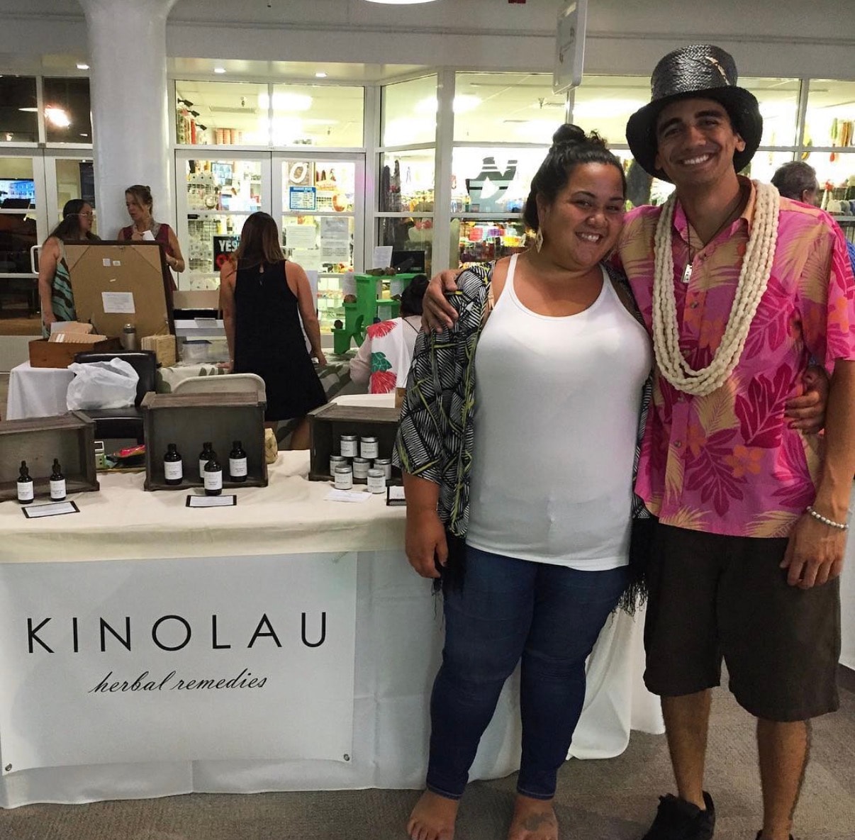 Couple at Kinolau herbal remedies market booth