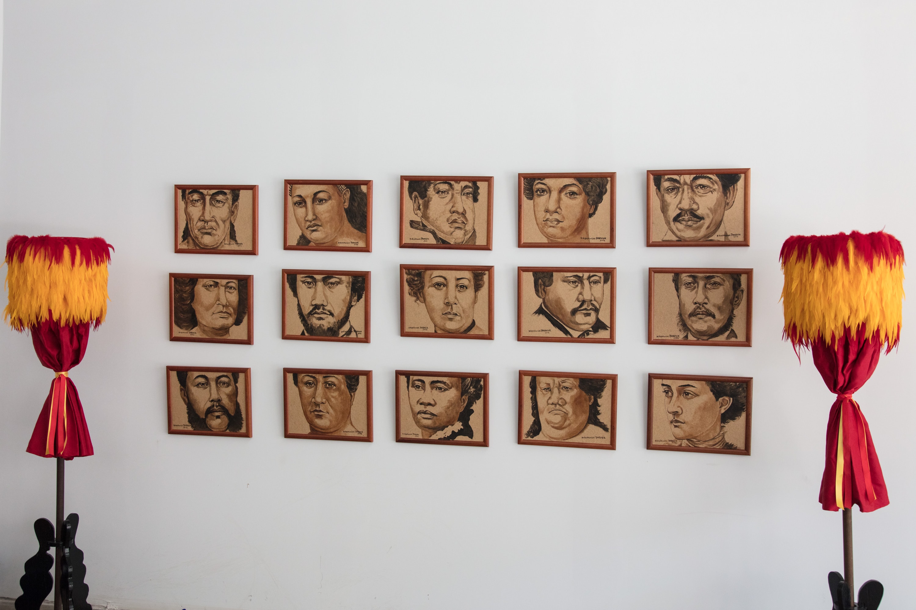Portrait drawings gallery wall with decorative umbrellas