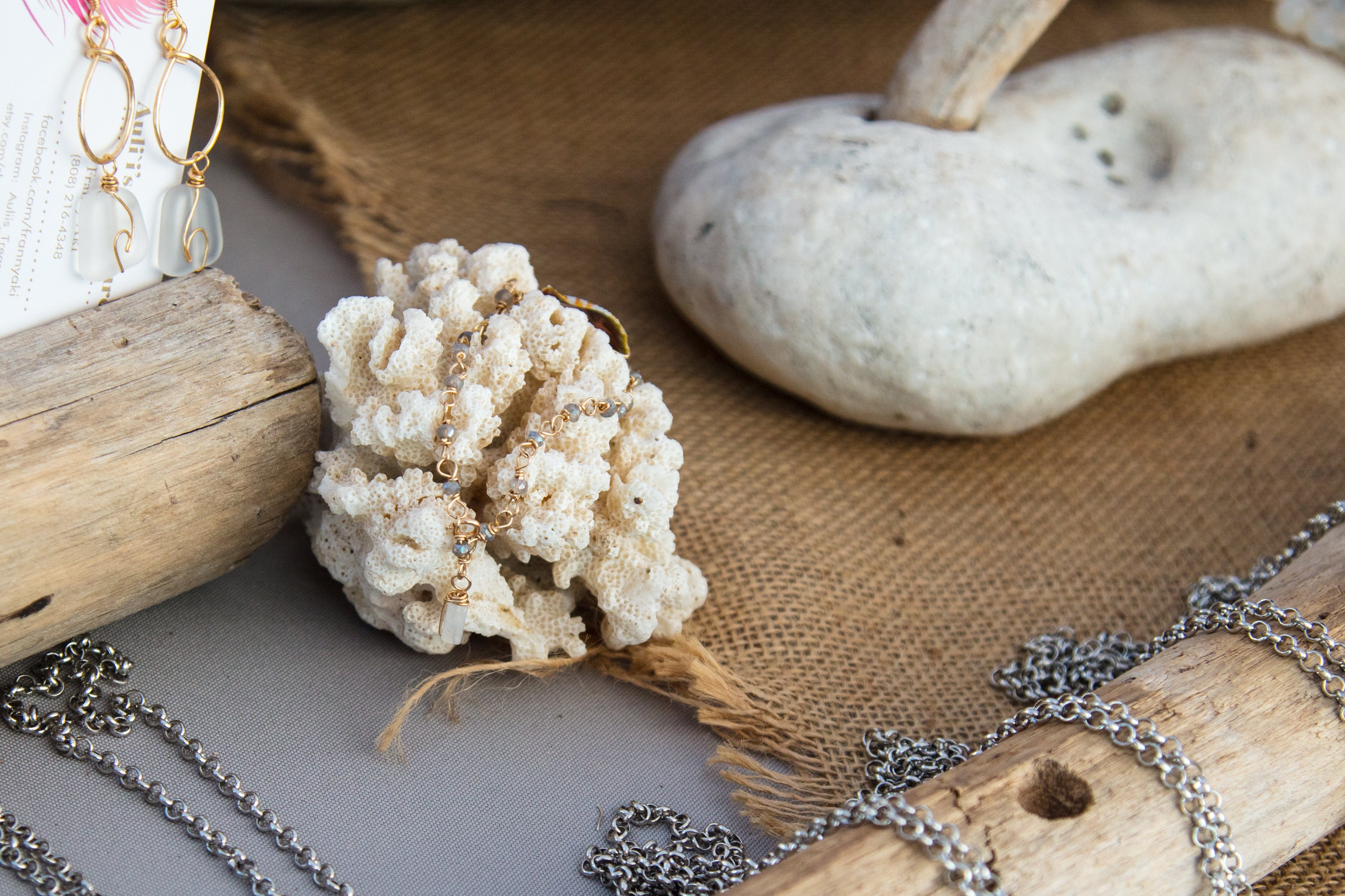 Handmade jewelry display with coral and stones
