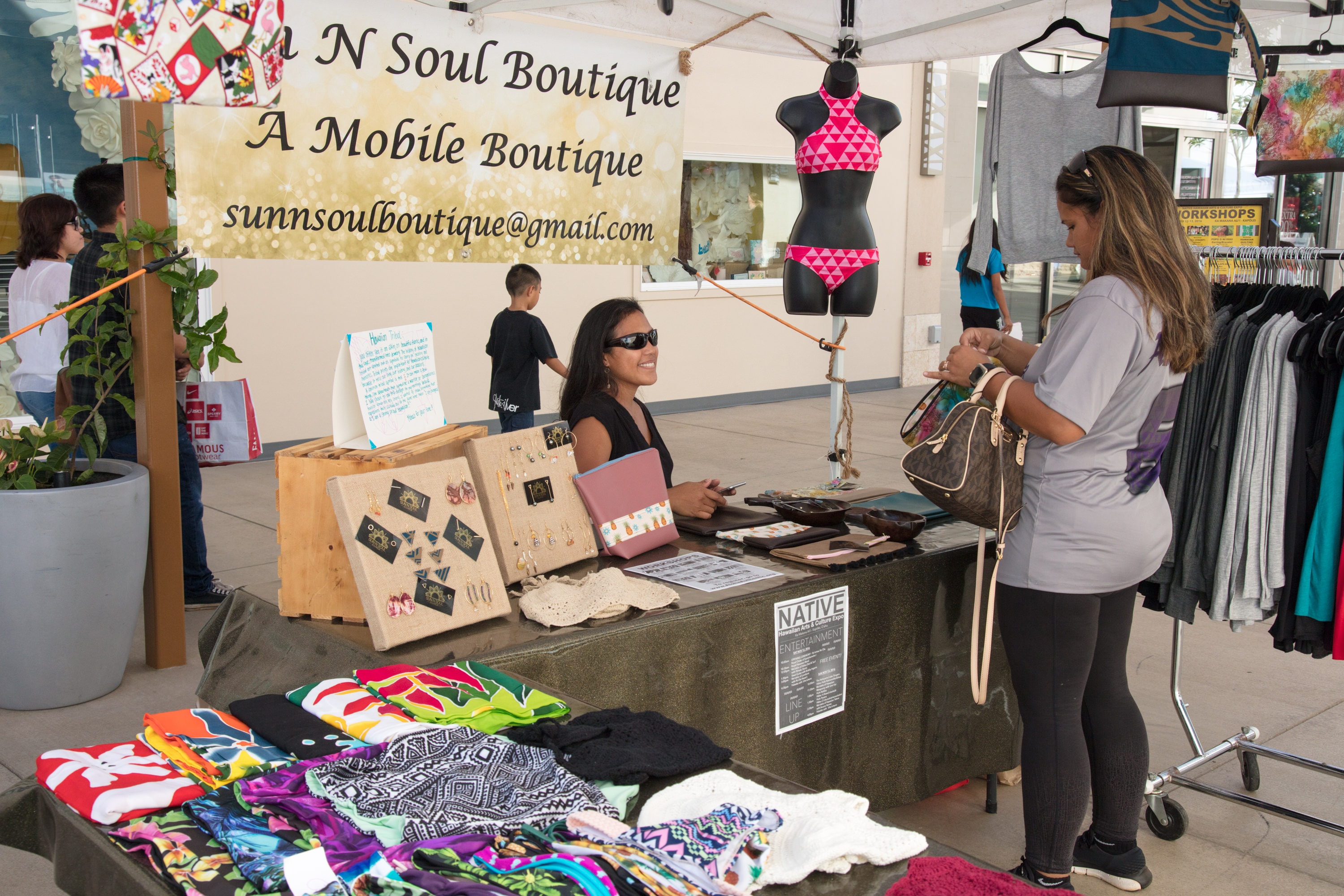Mobile boutique vendor selling colorful clothing