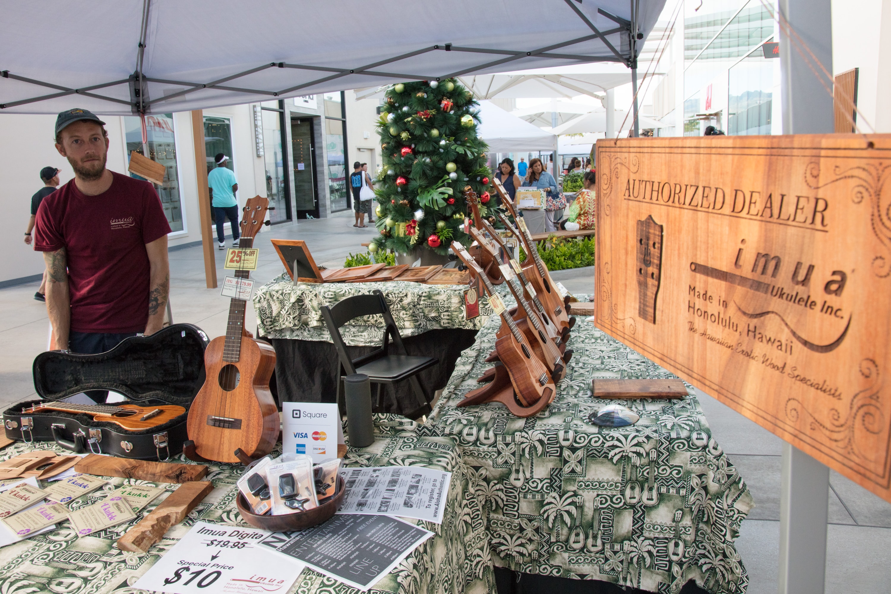Ukulele vendor at outdoor holiday market