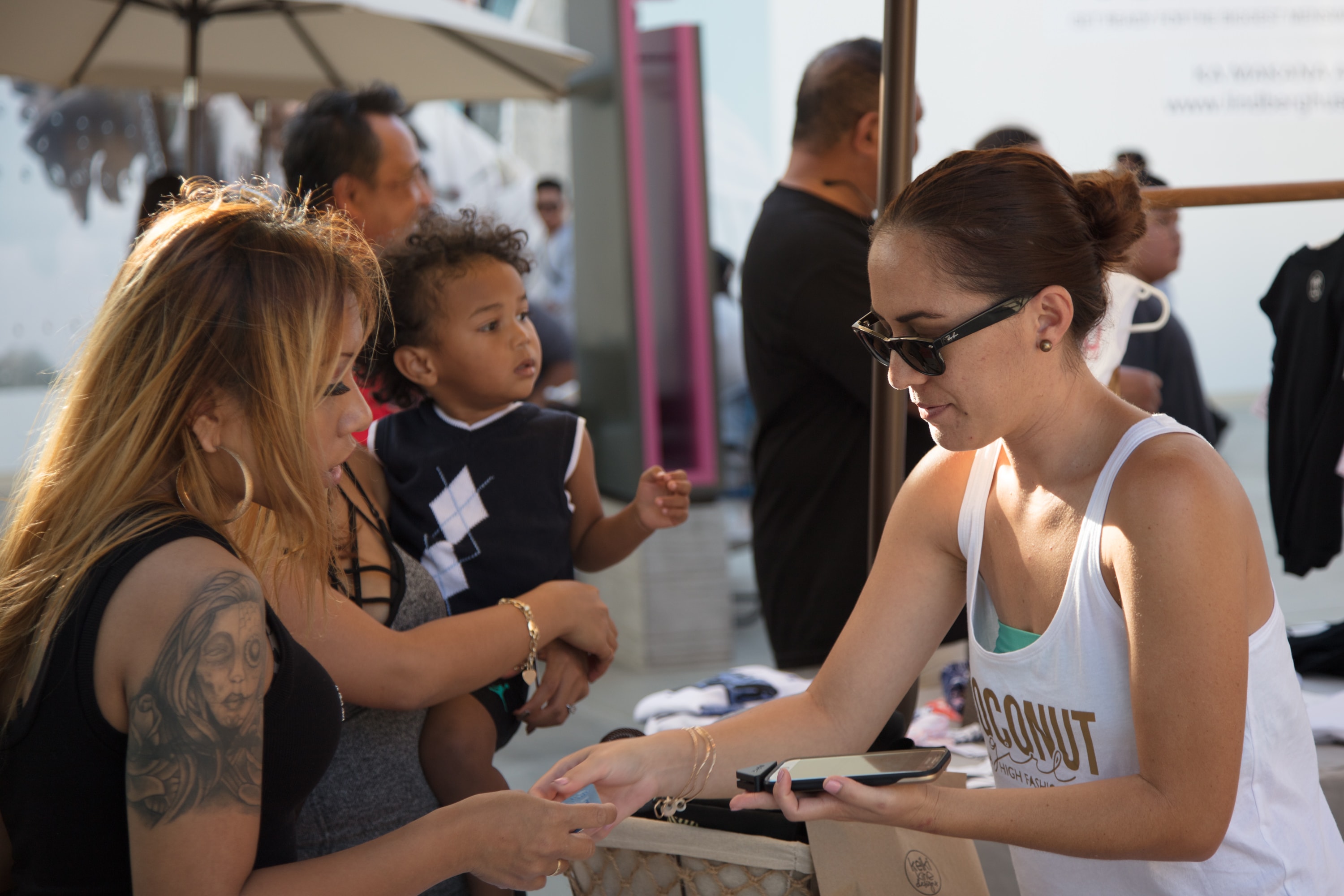 Woman helping family at outdoor event