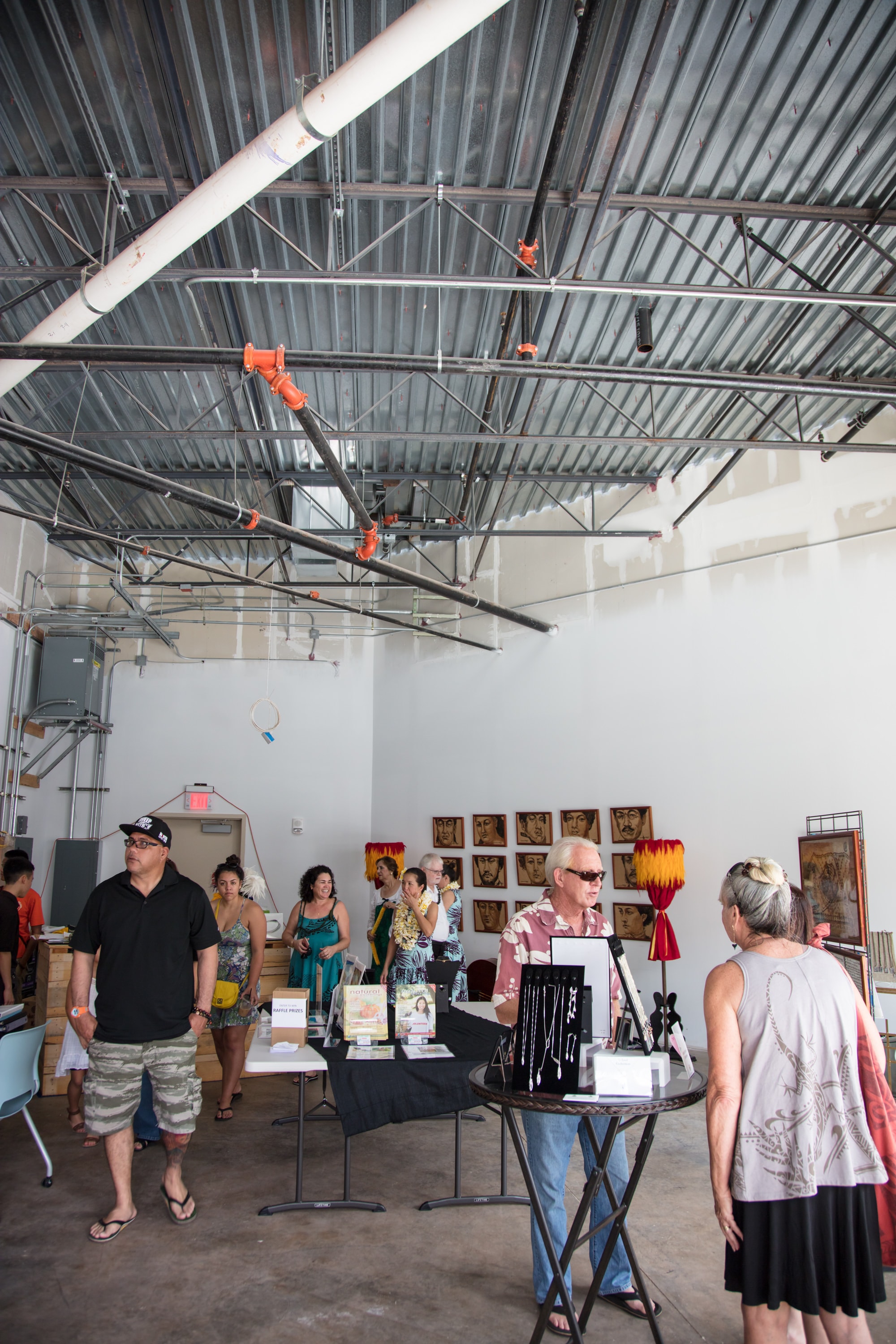 Art gallery opening in industrial warehouse space