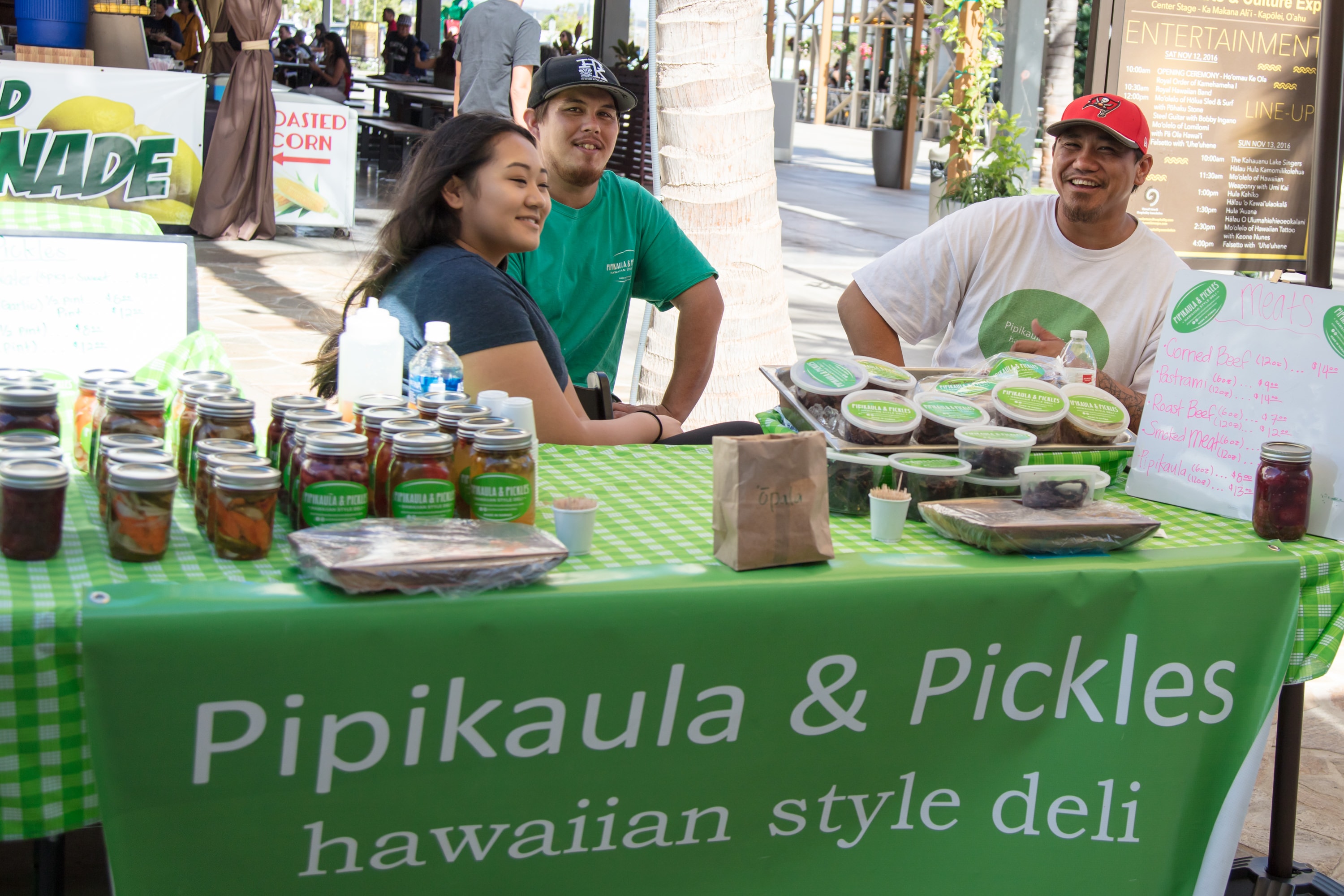 Vendors selling pipikaula pickles at market