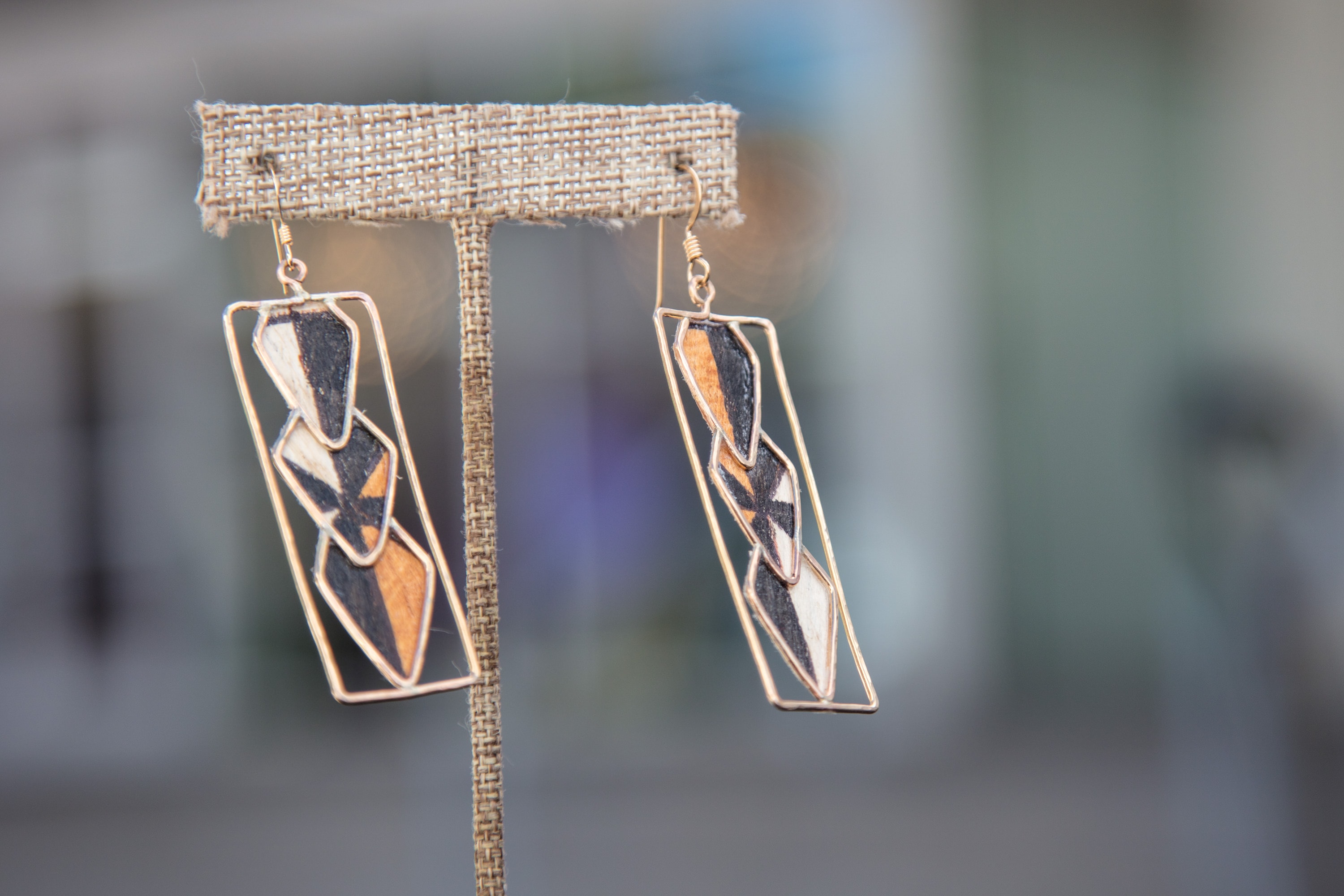 Geometric resin earrings with copper accents