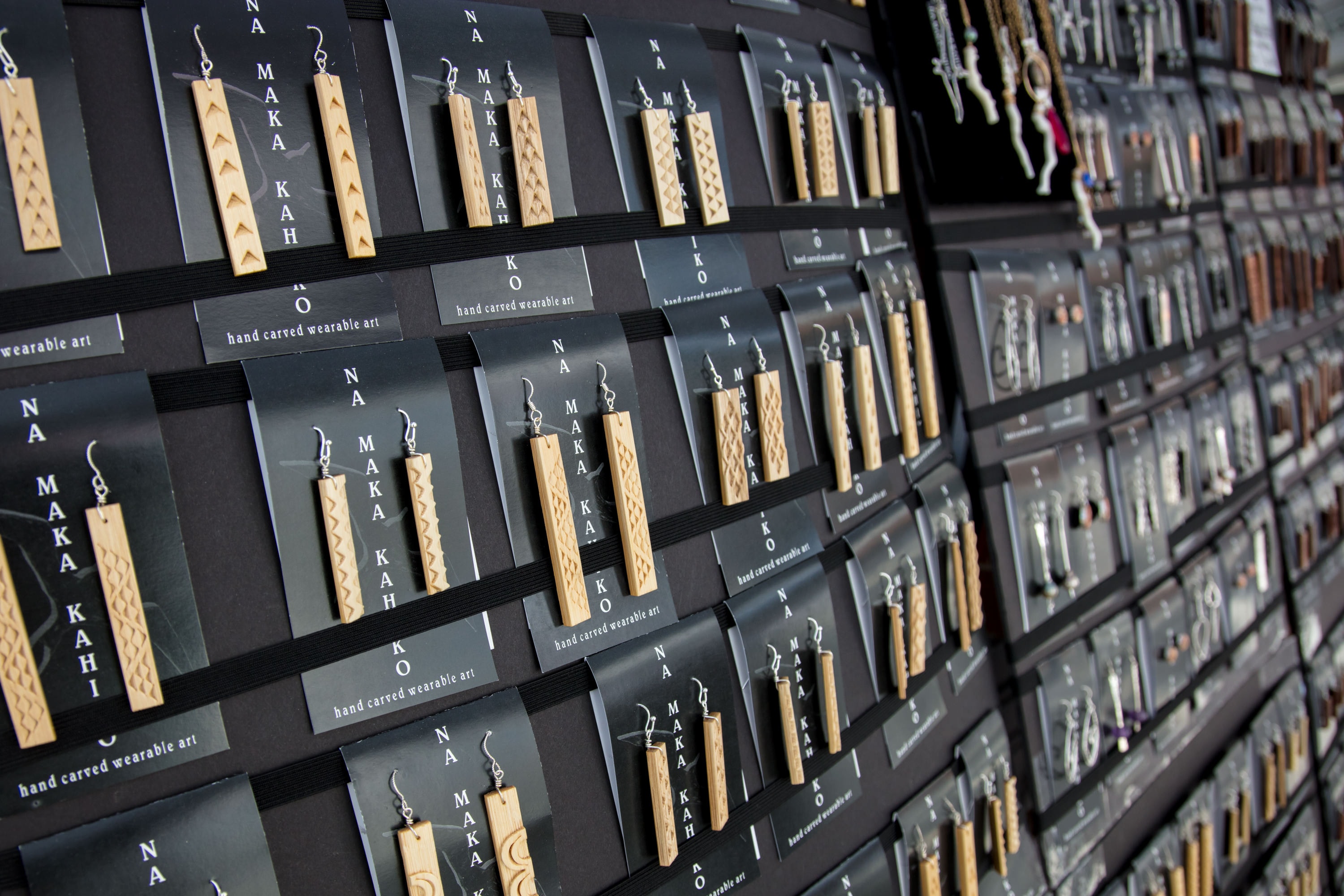 Wooden earrings displayed retail shop wall
