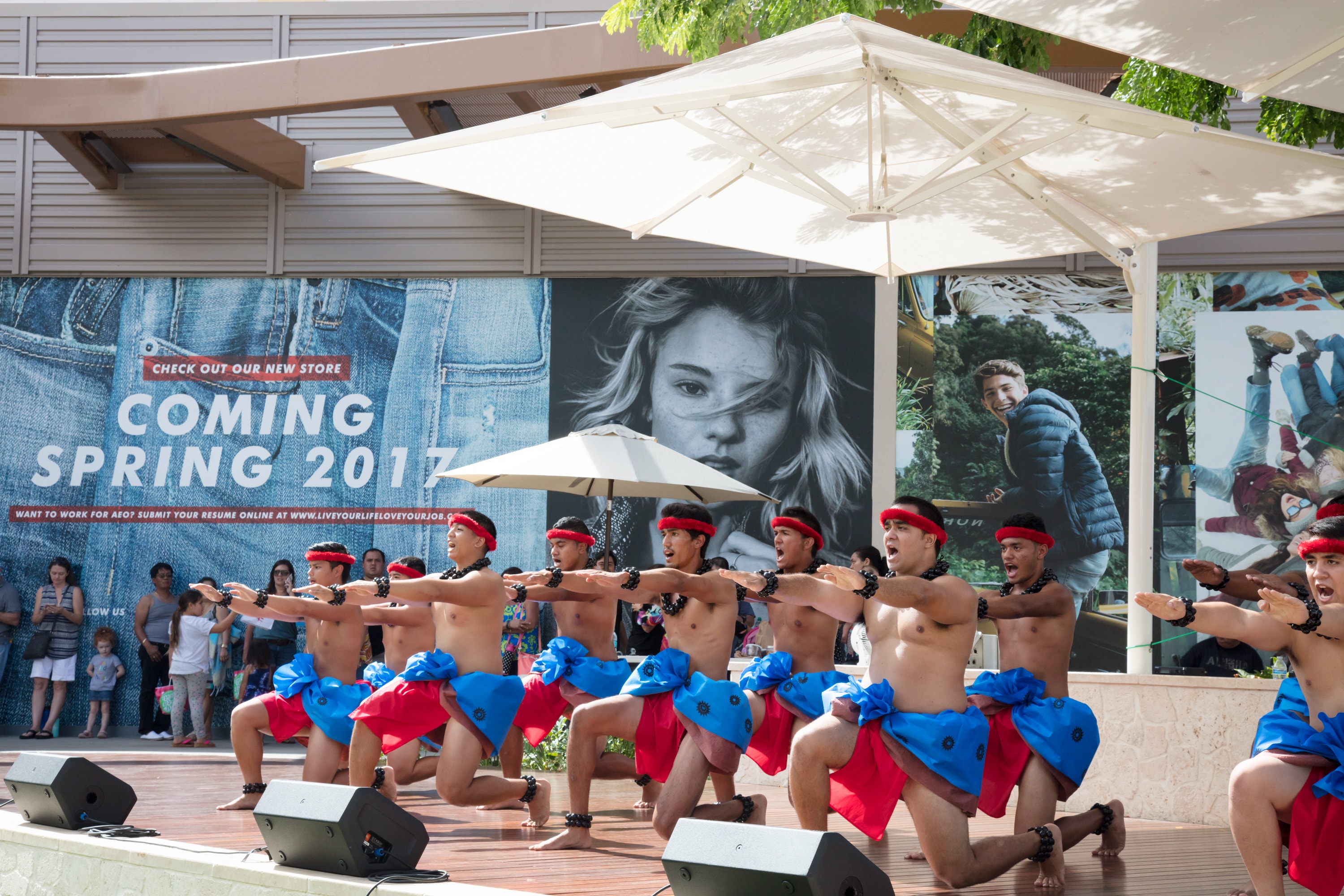 Shirtless dancers performing synchronized routine