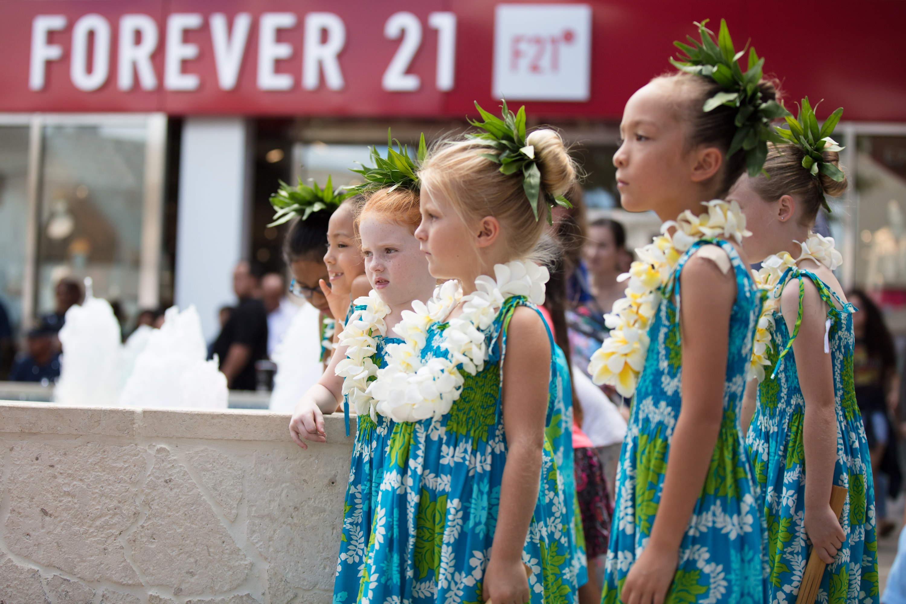 Children in Hawaiian lei parade performance