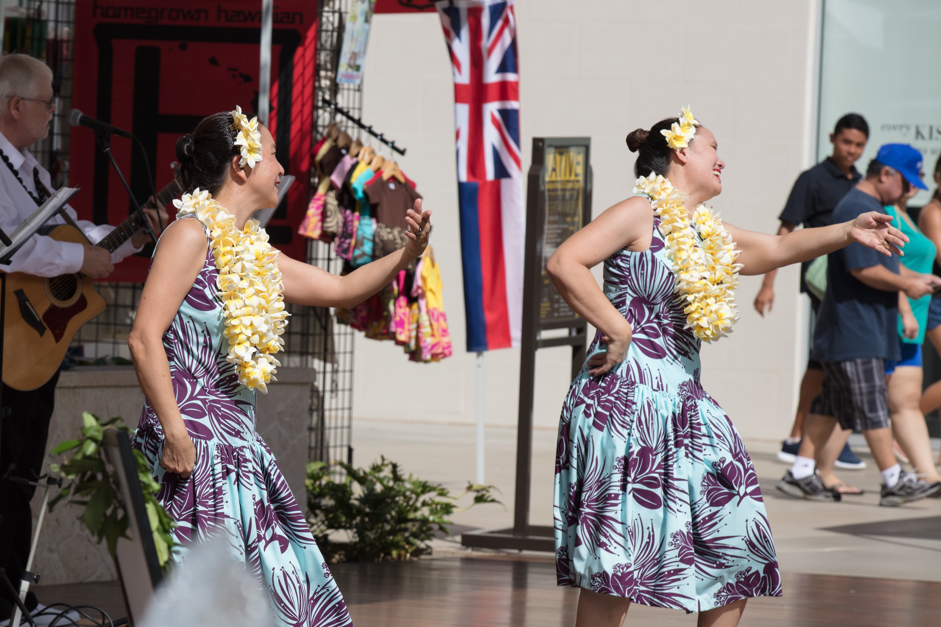 Hawaiian dancers performing with lei garlands
