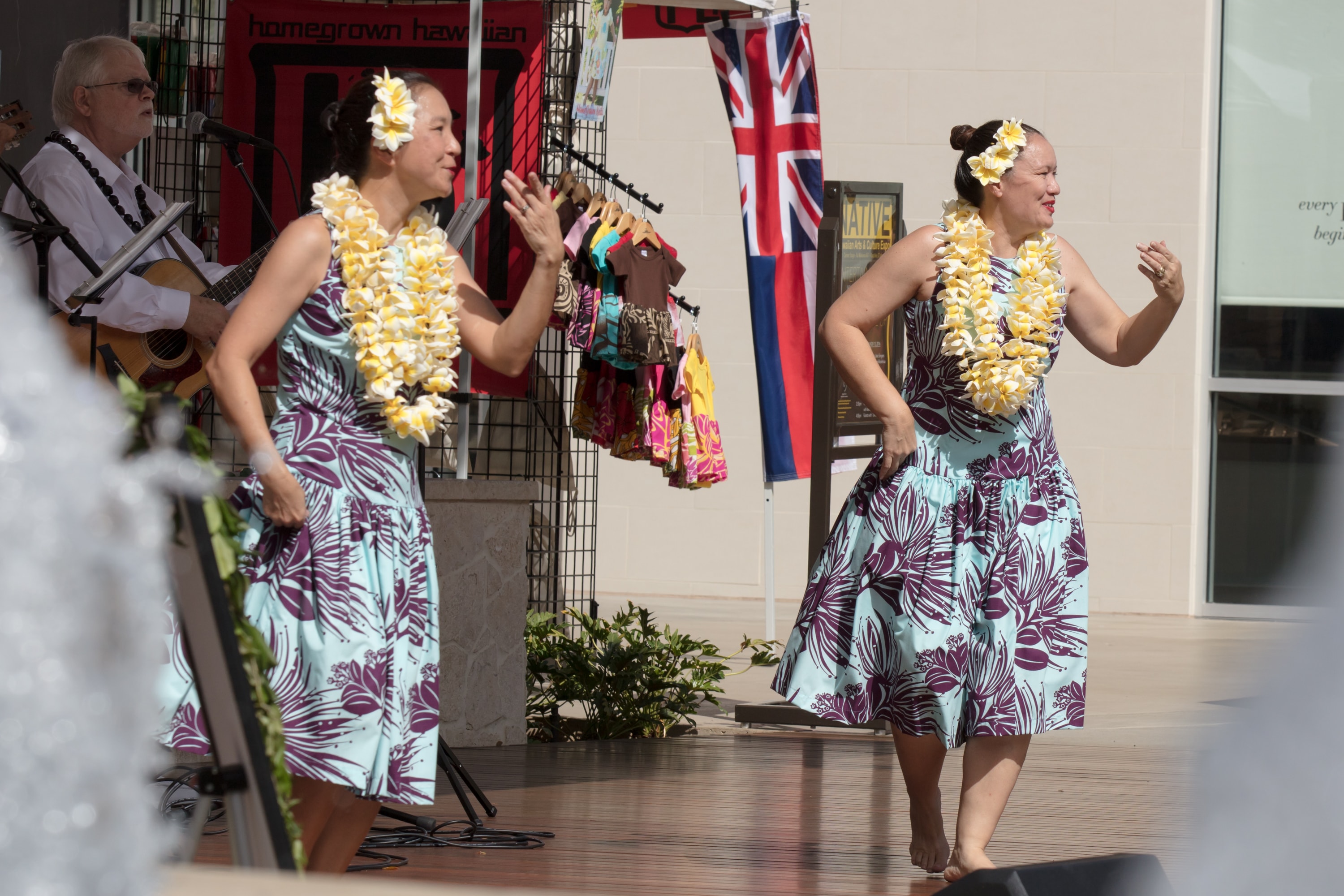Hawaiian dancers performing with lei garlands