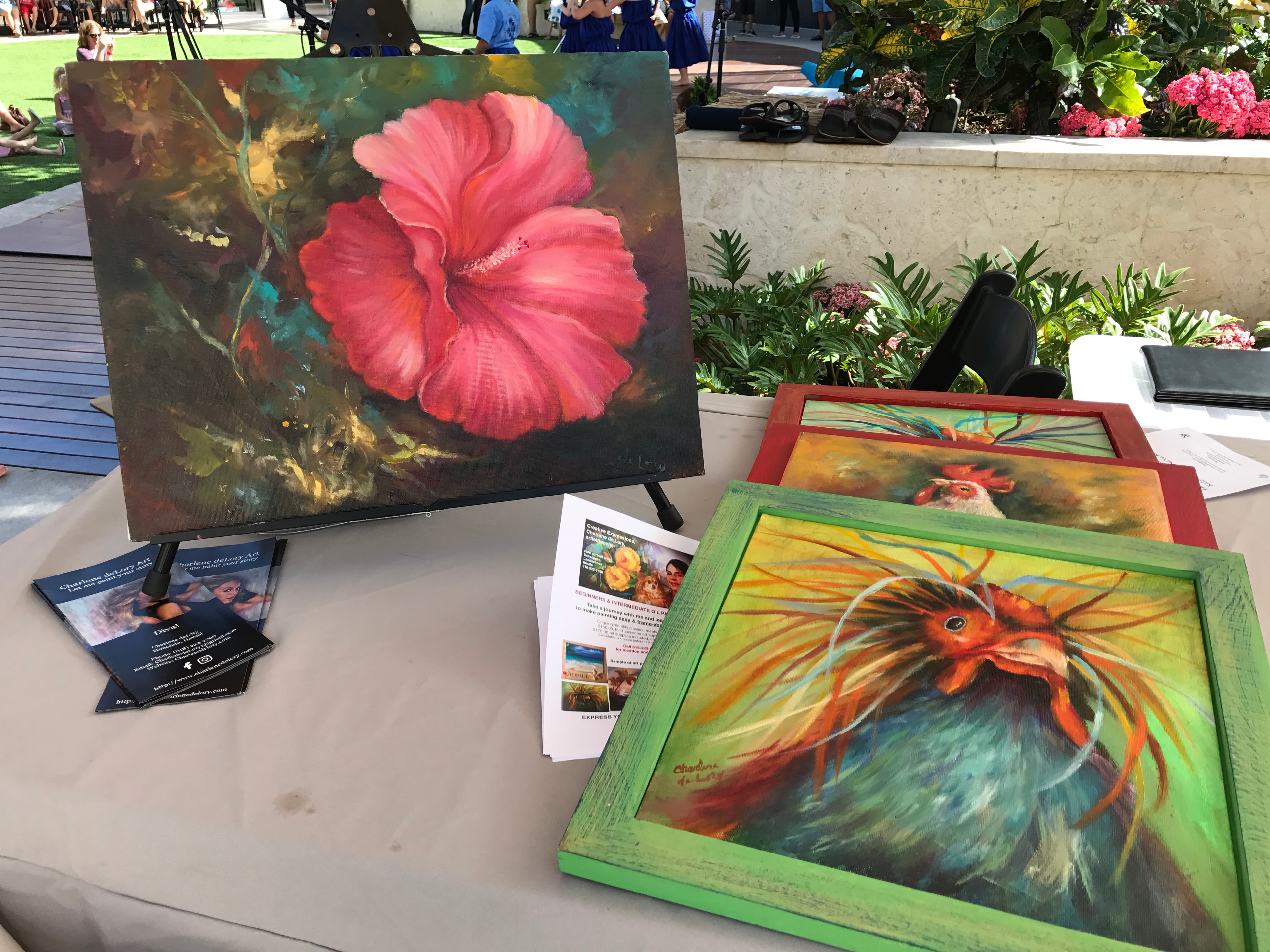 Artist paintings displayed outdoor market event